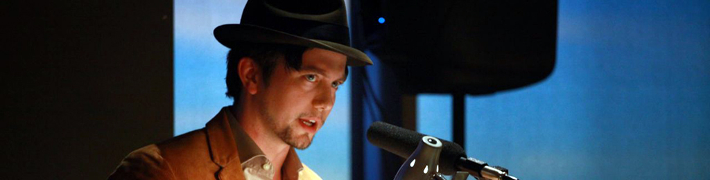 Man speaking into microphone.