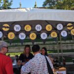 People participating in stew and brew booth.