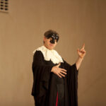 Man in costume acting.