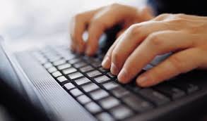 Hands typing on keyboard.