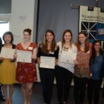 Group of people posing with awards.