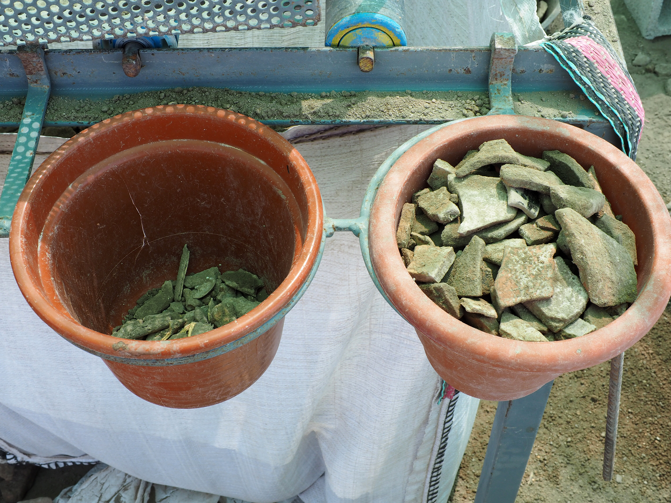 Buckets of old building materials.