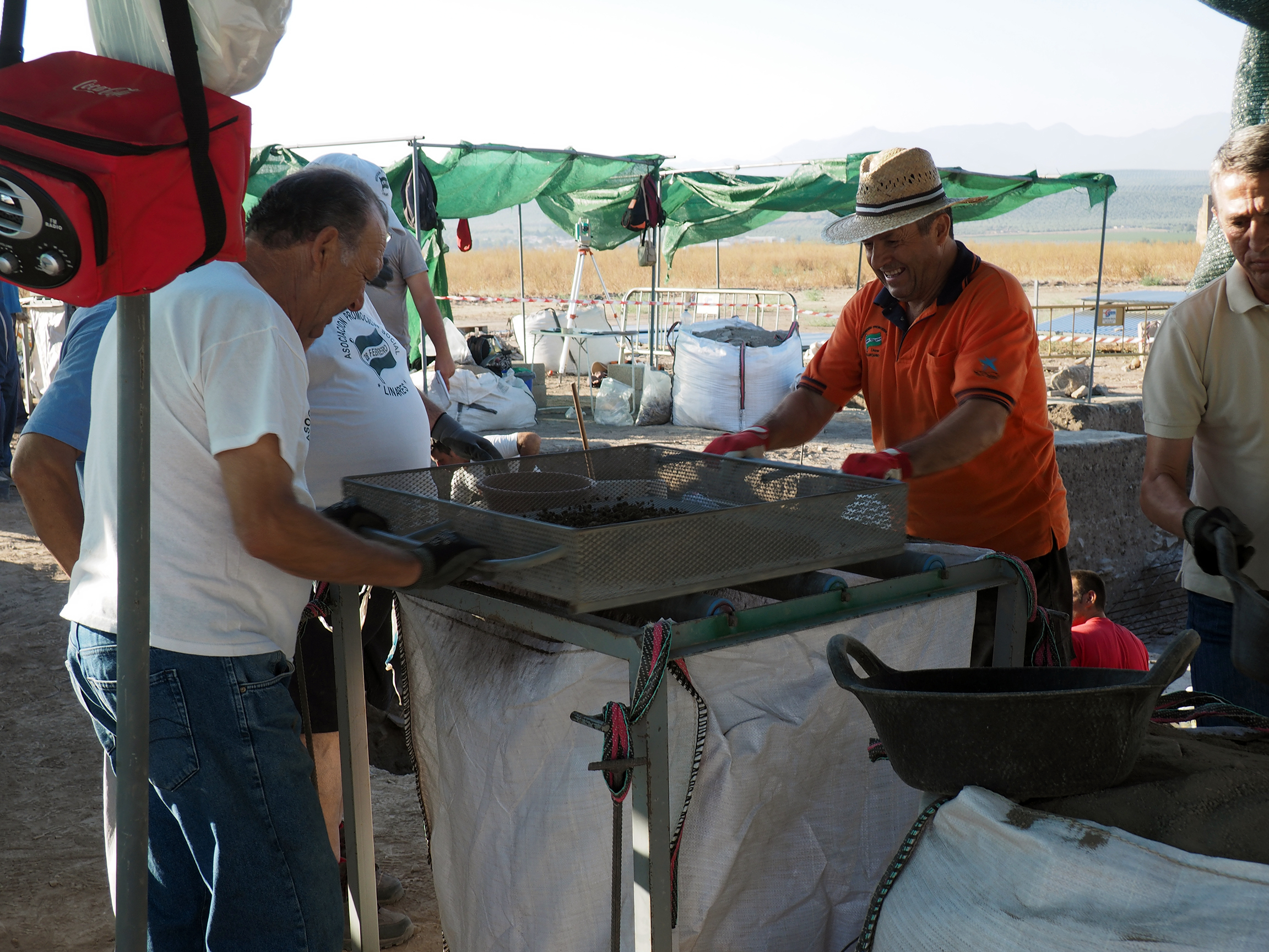 Men working at dig site.