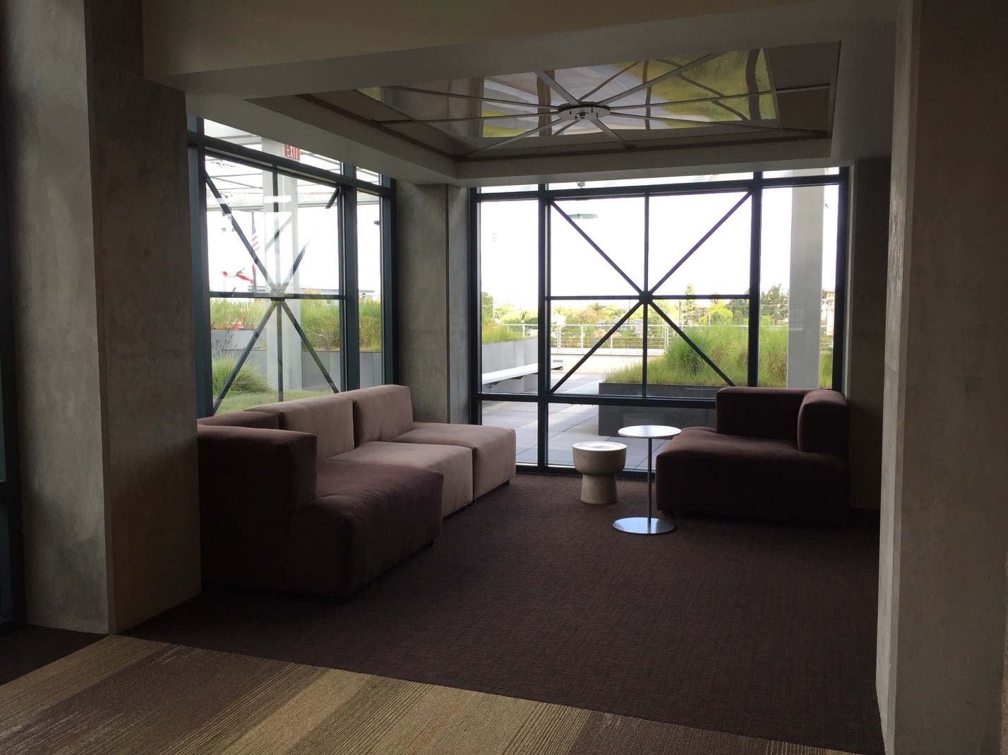 Area with chairs next to window.