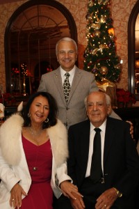 Catherine and James Emmi, pictured here with President Jim Doti at the annual Christmas at the Ritz event