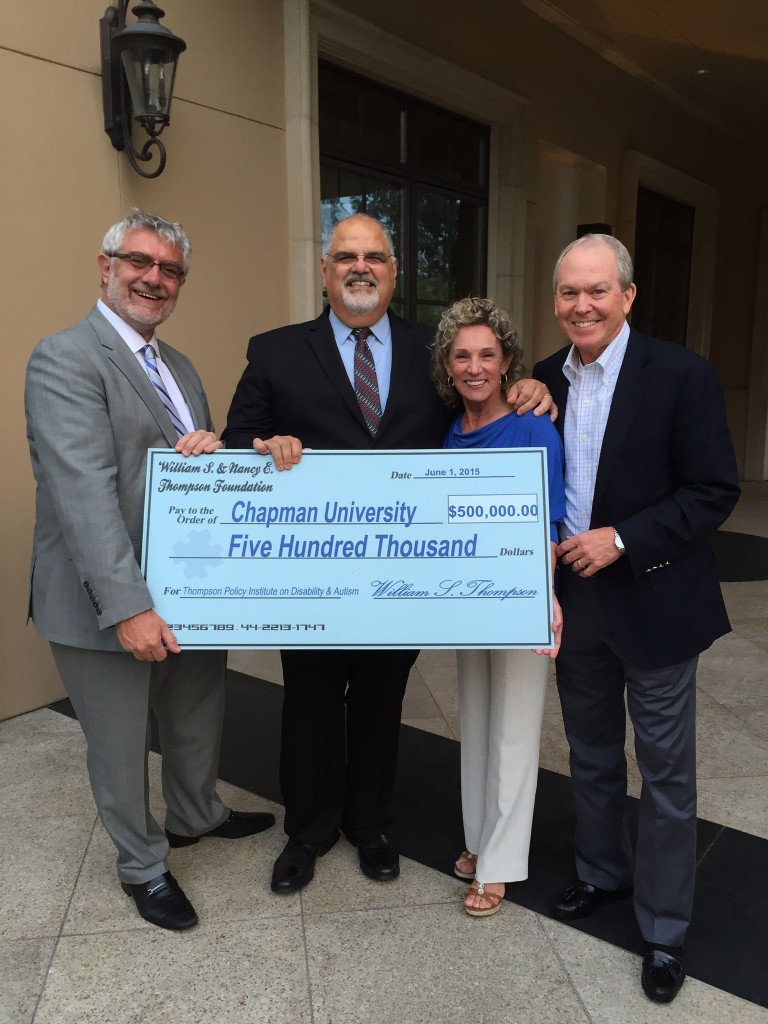 Group with large check for 500 thousand dollars to Chapman University
