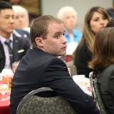 student listening to speaker