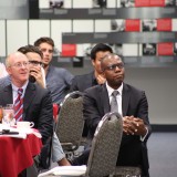 Dean Reggie Gilyard listening to what Eric Brandt has to say.