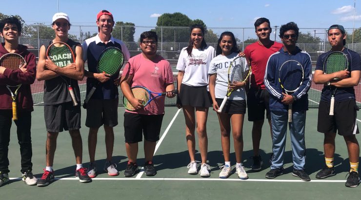 Austin Price on the tennis court with team members