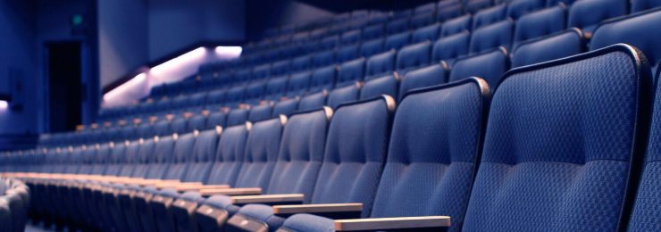 rows of blue seats in Waltmar Theatre