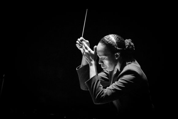 Black-and-white photo of Kalena Bovell conducting
