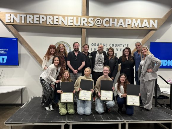 Karli and the other students with mentors at the incubator program