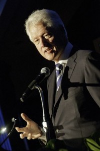 Bill Clinton speaking into microphone.