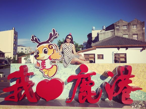 Lindsey posing in a local Taiwanese city.
