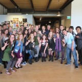Students pose with Stanton and Catmull at PIXAR studios.
