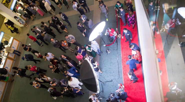 birds eye shot of a group on a red carpet