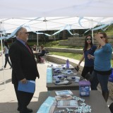 Dean Donald Cardinal, Ph.D., visits the Communications Science and Disorders autisim Awareness tent