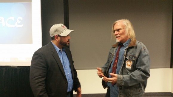 Michael Benitez Jr. (right) speakin with Dr. Peter McLaren (left)