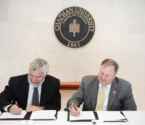 Chancellor Daniele Struppa and president of Saddleback College Dr. Tod Burnett sign the sciences transfer admission guarantee between the two institutions.