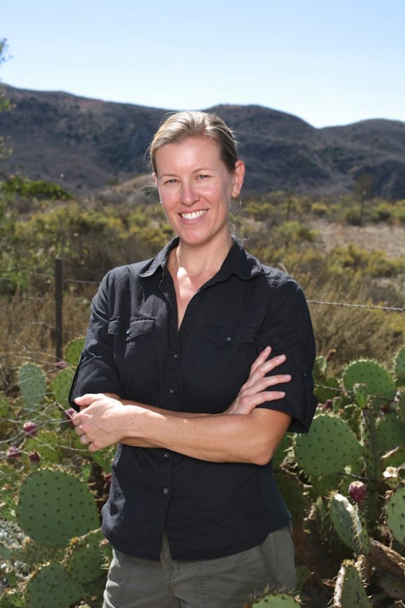 Professor Jennifer Funk, pictured here at the Irvine Ranch Conservancy, researches how native and non-native plants compete for resources.