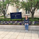 Sara Siwiecki sitting outside Yale's School of Medicine where she's participating in a REU.