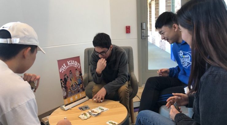 students playing card game