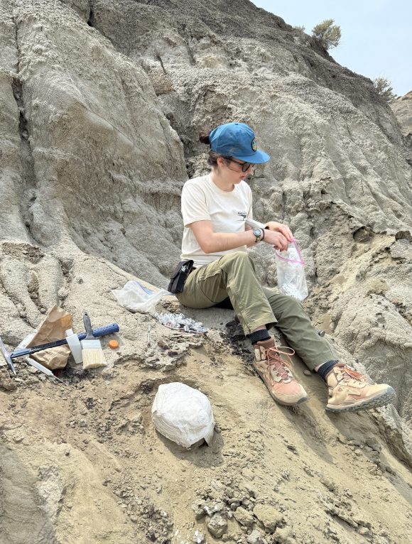 Student works on archaeological dig.