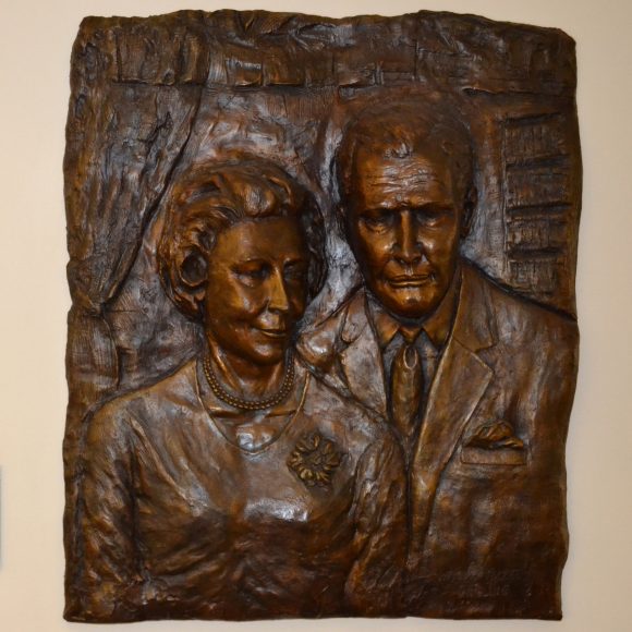 bronze relief of Hugh and Hazel Darling on view in the library