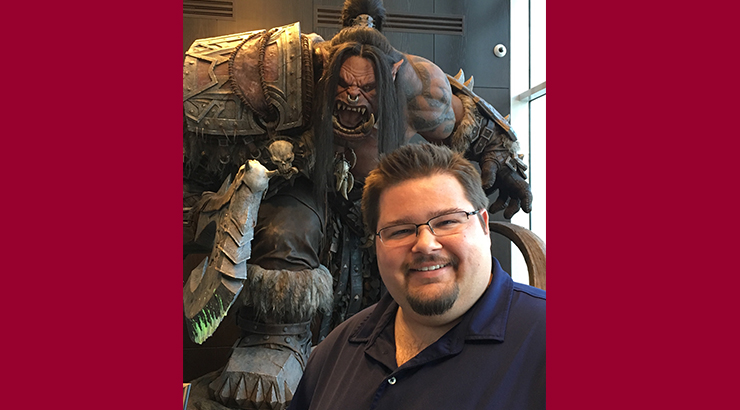 Jack Anderson with a larger than life statue of ‘Grommash Hellscream’ from World of Warcraft at Blizzard HQ”