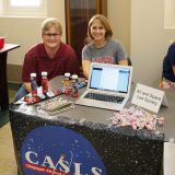 students sit behind the Air & Space Law Society table