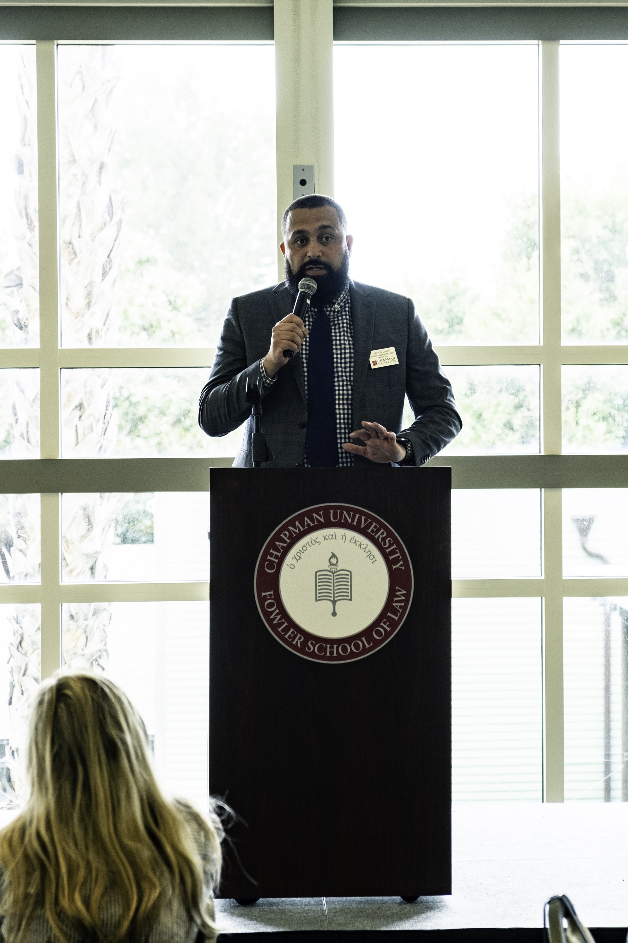 Photograph of admissions and diversity Assistant Dean Cruz presenting to prospective students during scholars weekend