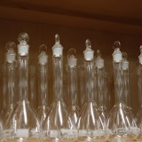Empty beakers on a shelf