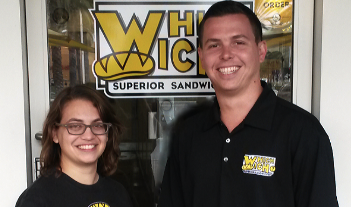 Chiara stands with the owner of Which Wich