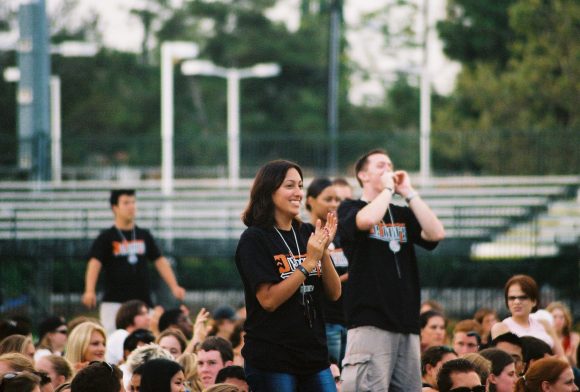 People cheering on a field