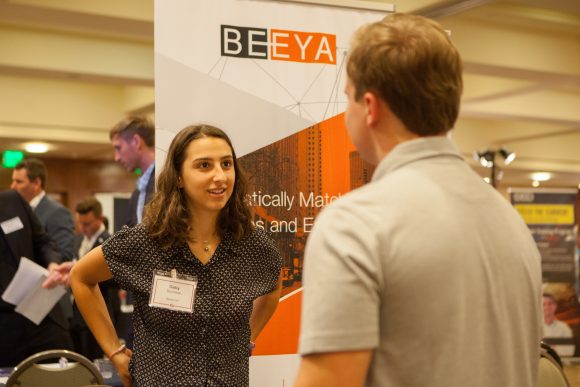 Beeya rep speaking with Chapman student at career fair