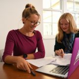 A student assisting an instructor