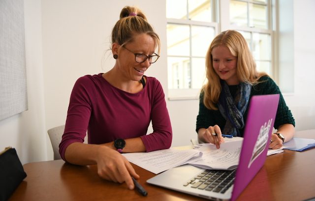 A student assisting an instructor