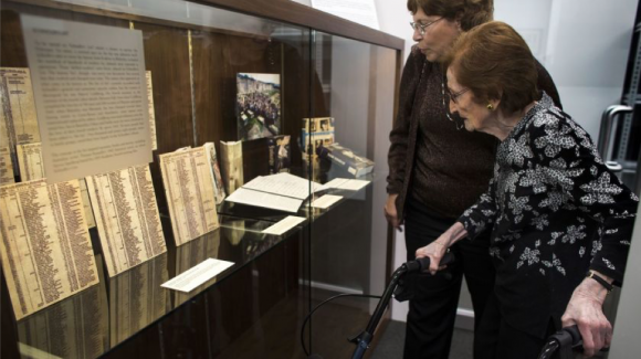 Mila Page and daughter Marie Knecht view a display in the Oskar Schindler archive