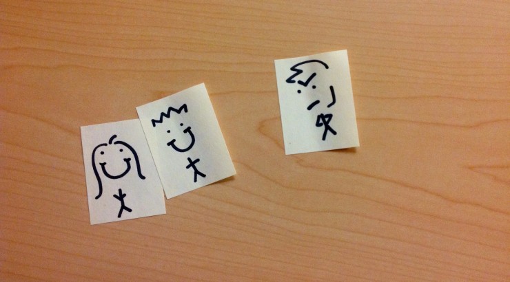 Sticky notes with people drawn on them