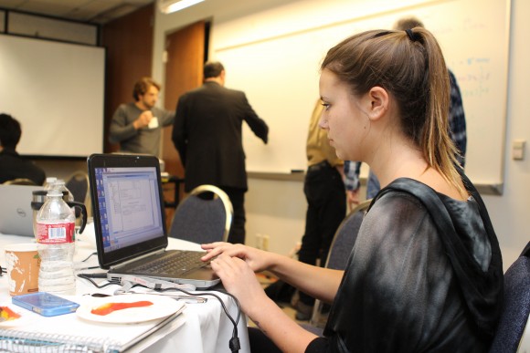 Student on her computer at the Big Data event at Chapman
