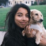 nikita holding a dog