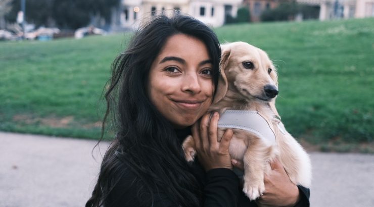 nikita holding a dog