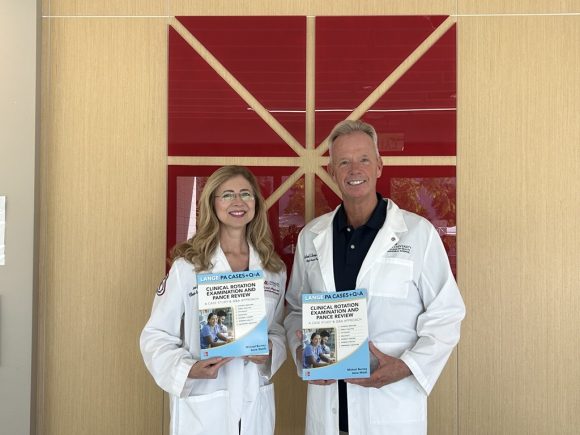 Anne Walsh and Mike Burney with Textbook