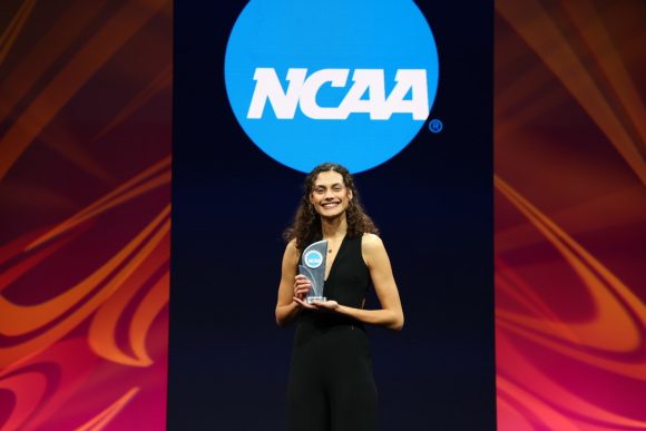 Sophie holding an award