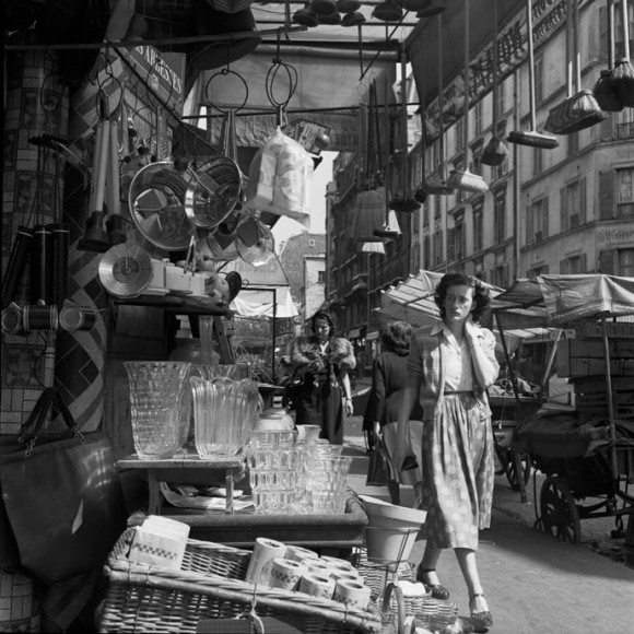 woman walking through a street shop