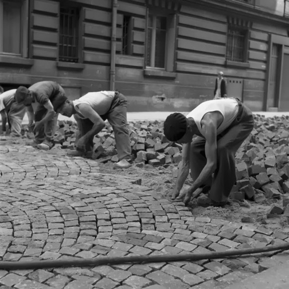 men moving bricks