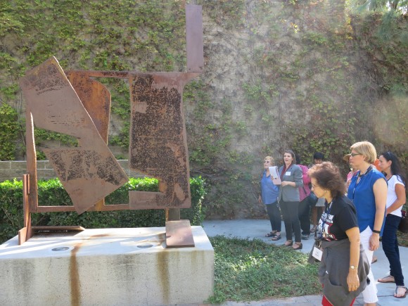 people looking at a sculpture