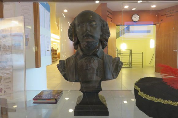 Shakespeare bust in display case.