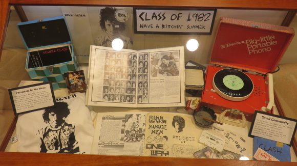 Display case filled with material, titled, "Class of 1982"