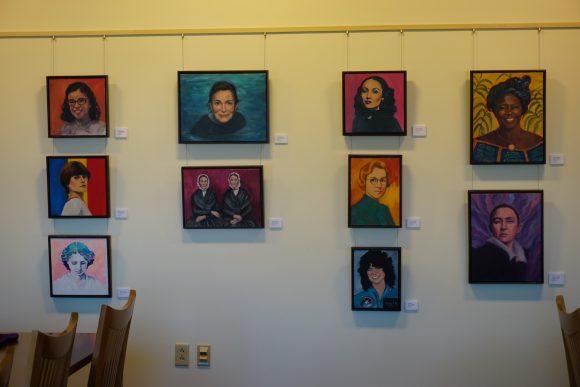 Framed portraits hanging on a wall